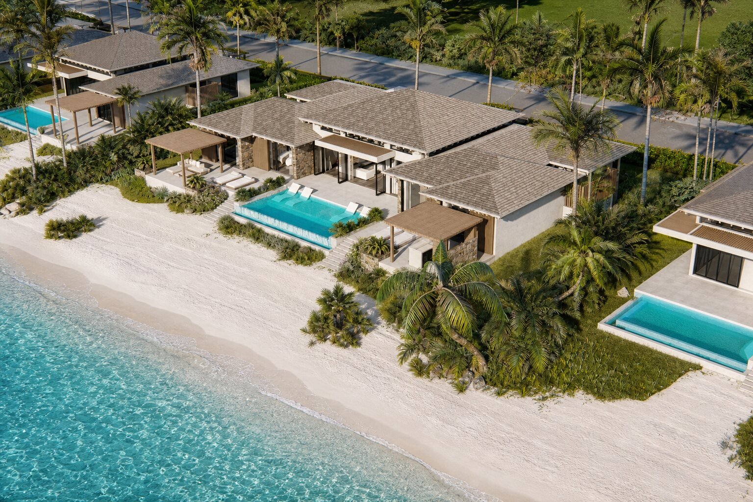 Aerial view of the 5-Bedroom Villa showing both pools and the widest beachfront frontage in the collection